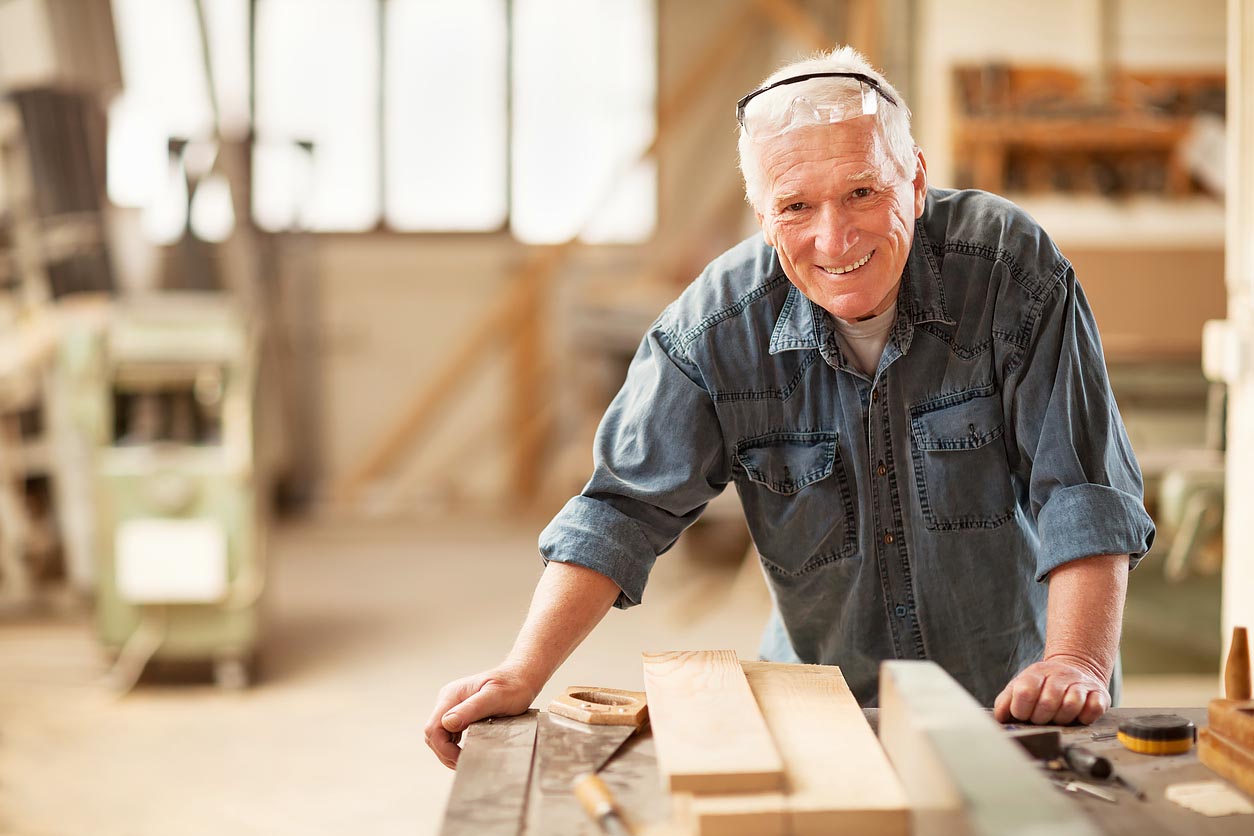 Mature carpenter at work